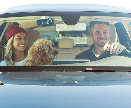 Couple in a car with a window dash cam right